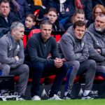 assistant coach Rene Hake of Feyenoord and head coach Robin van Persie of Feyenoord and assistant coach John de Wolf of Feyenoord looks on during the Dutch Eredivisie match between PSV Eindhoven and Feyenoord Rotterdam at Philips Stadion on February 1, 20