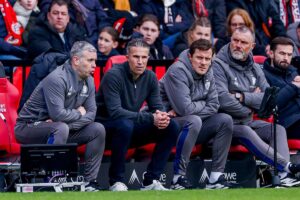 assistant coach Rene Hake of Feyenoord and head coach Robin van Persie of Feyenoord and assistant coach John de Wolf of Feyenoord looks on during the Dutch Eredivisie match between PSV Eindhoven and Feyenoord Rotterdam at Philips Stadion on February 1, 20